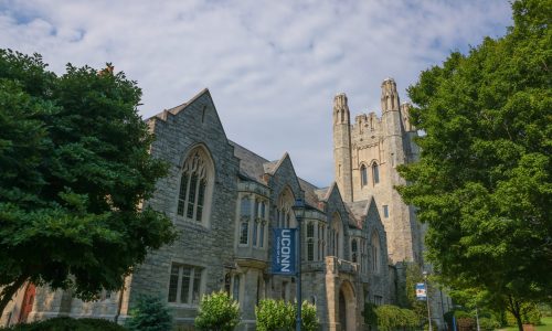 Landscape view of a UConn Law School building during the summer