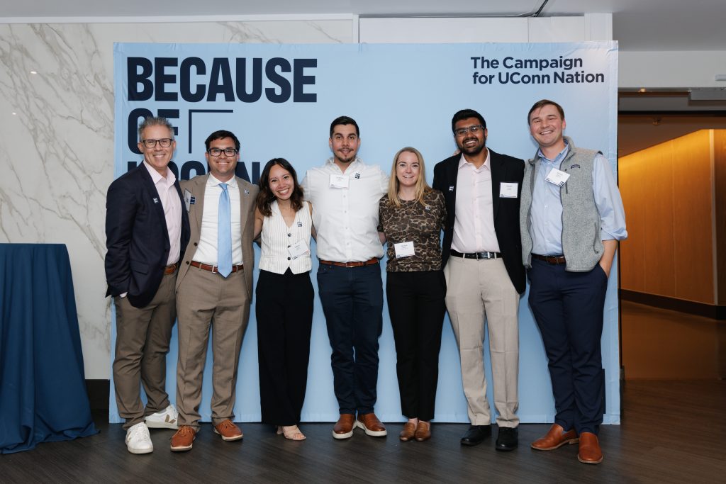 People posing for a photo at the Because of Boston event