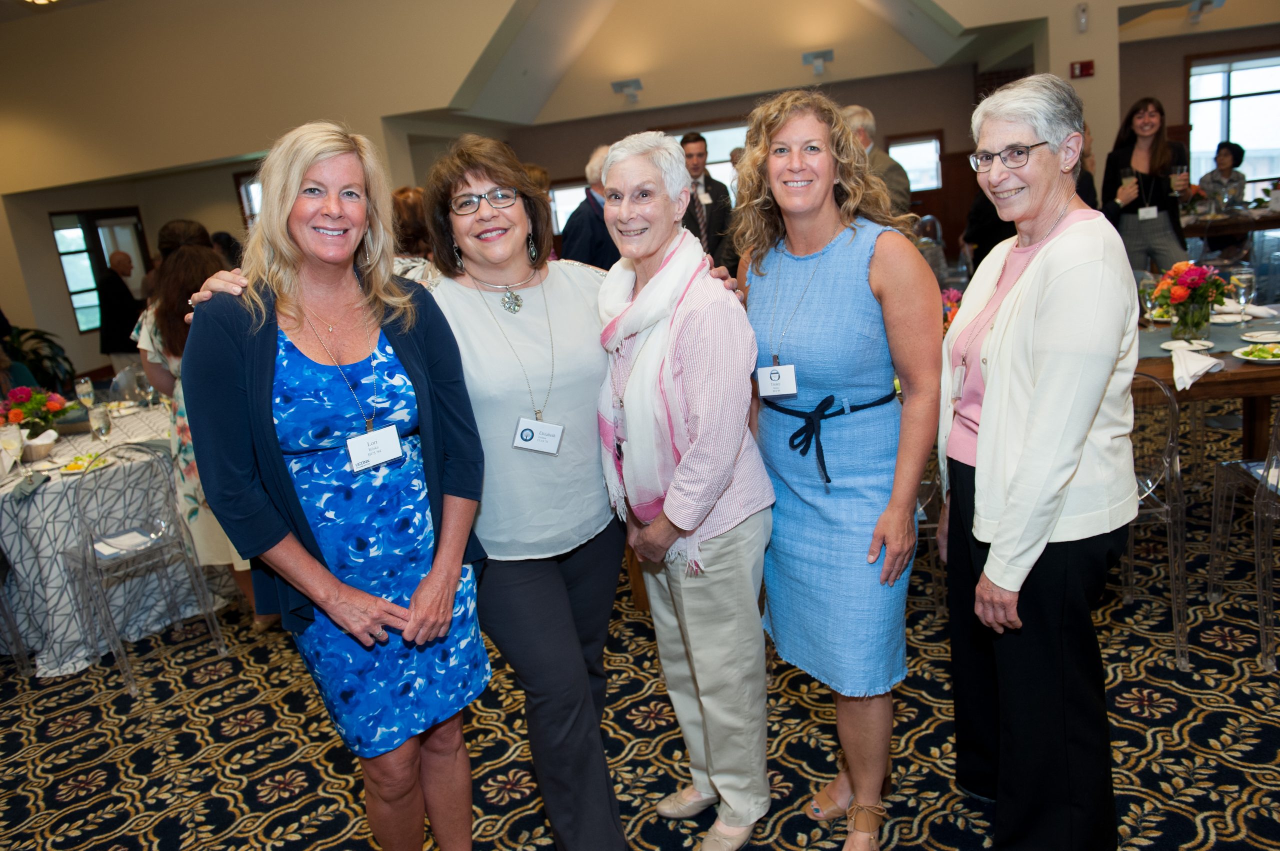 Lori Riiska, Elizabeth Zezima, Treacy Riiska and others posting at the Charles Lewis Beach Society spring brunch