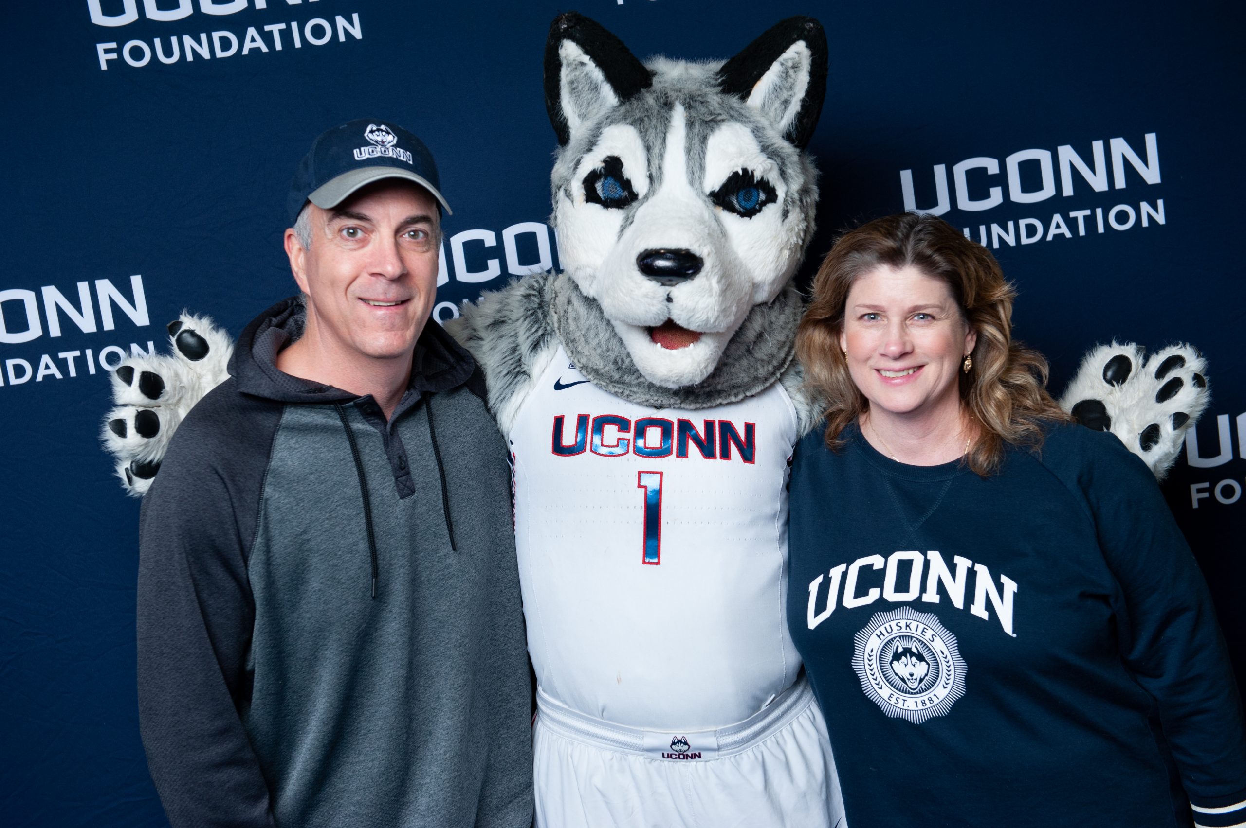 Thomas Iarusso and Beth Iarusso posing with Jonathan the mascot at the Loyal Jonathan Brunch