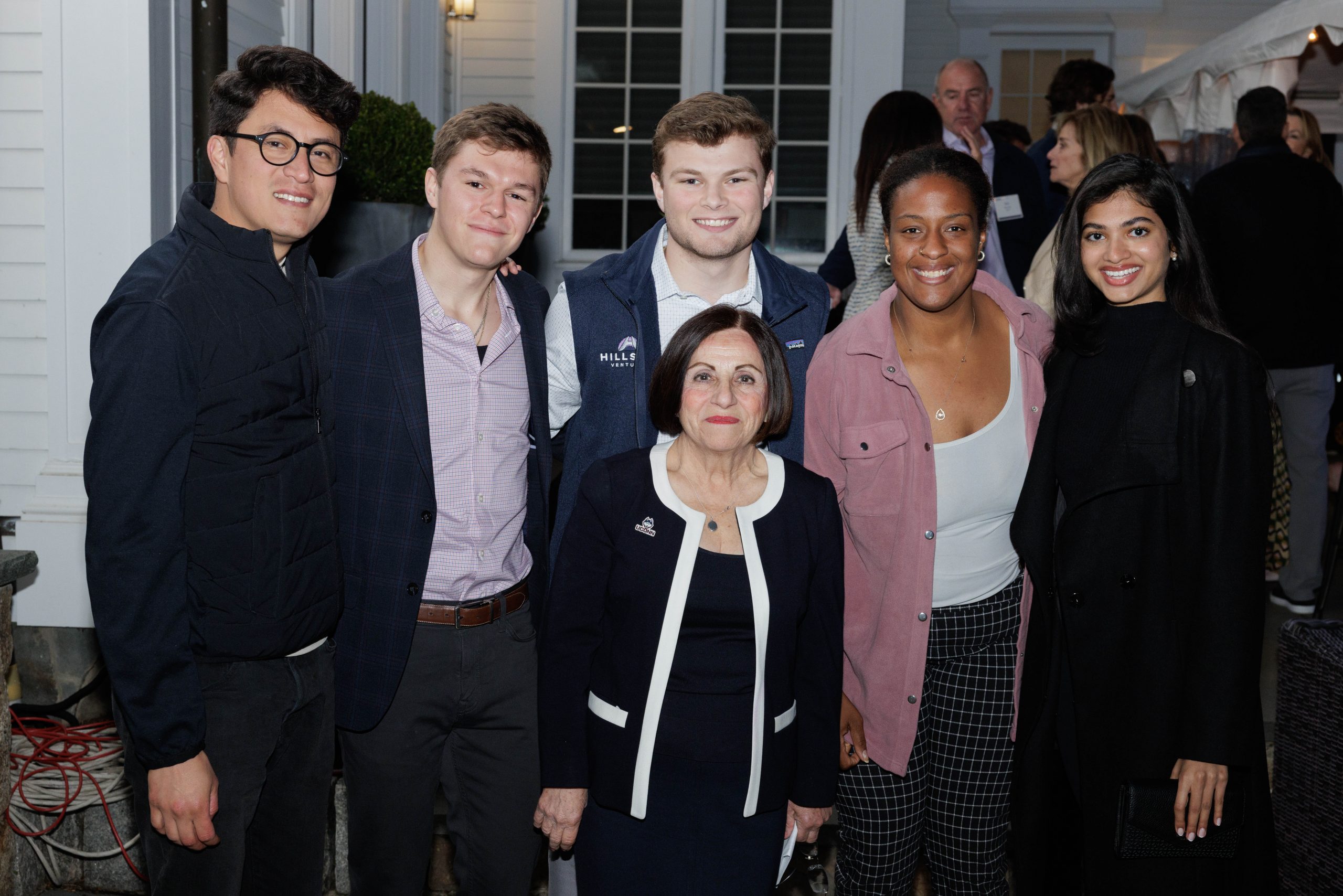 Toni Boucher posing for a photo with UConn students
