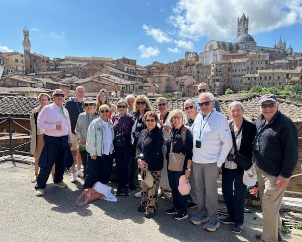Flavors of Tuscany - group in Siena The "Flavors of Tuscany" travel trip group posing in front of the city of Siena, Italy