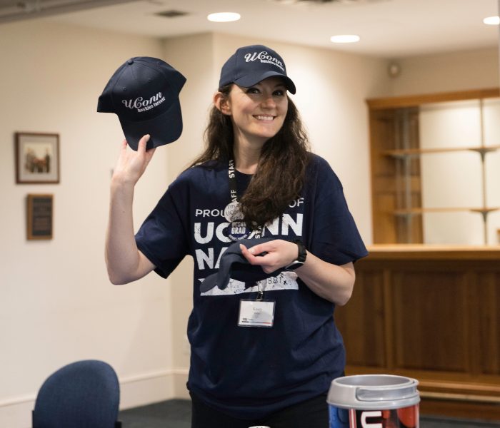 Senior Send-off A volunteer holding up a hat during senior send-off