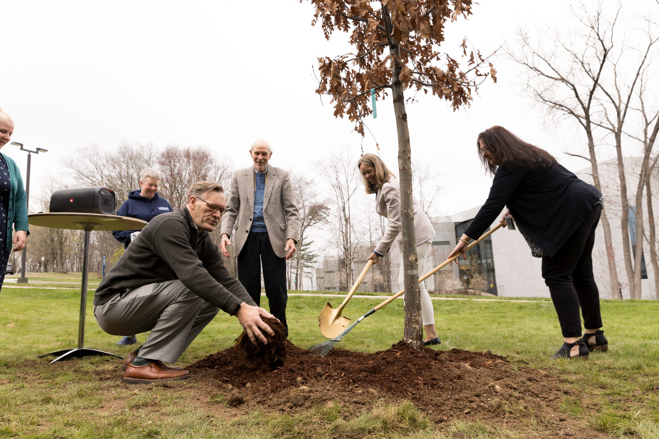 Pictures of the tree planting in front of the Alumni building, celebrating the health and wellness of people and planet.