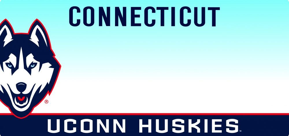 UConn-CTLicense-Plate-Current-Husky Connecticut license plate with a light blue gradient background. A large modern UConn Husky head logo appears on the left side. The word ‘CONNECTICUT’ is centered at the top in dark blue letters. A navy band at the bottom reads ‘UCONN HUSKIES’ in white, bordered by a thin red line.
