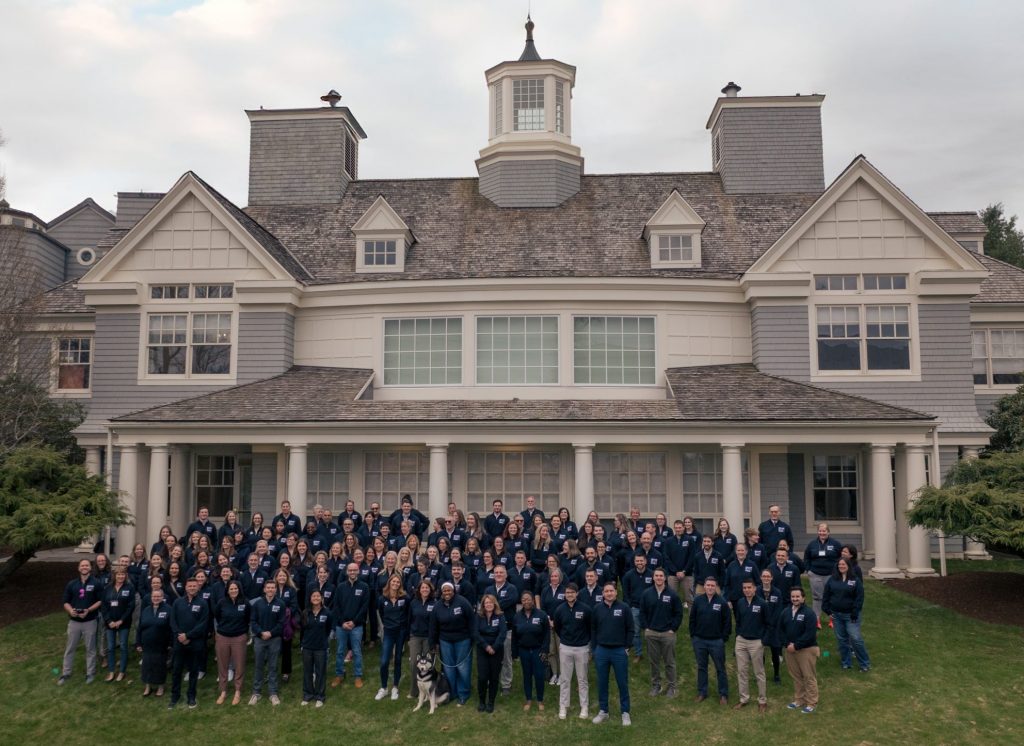 Group picture of the Foundation Staff outside the Alumni Center building