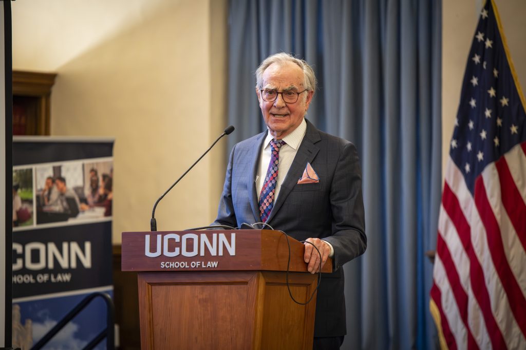 Wesley Horton makes remarks at a "UConn School of Law" podium
