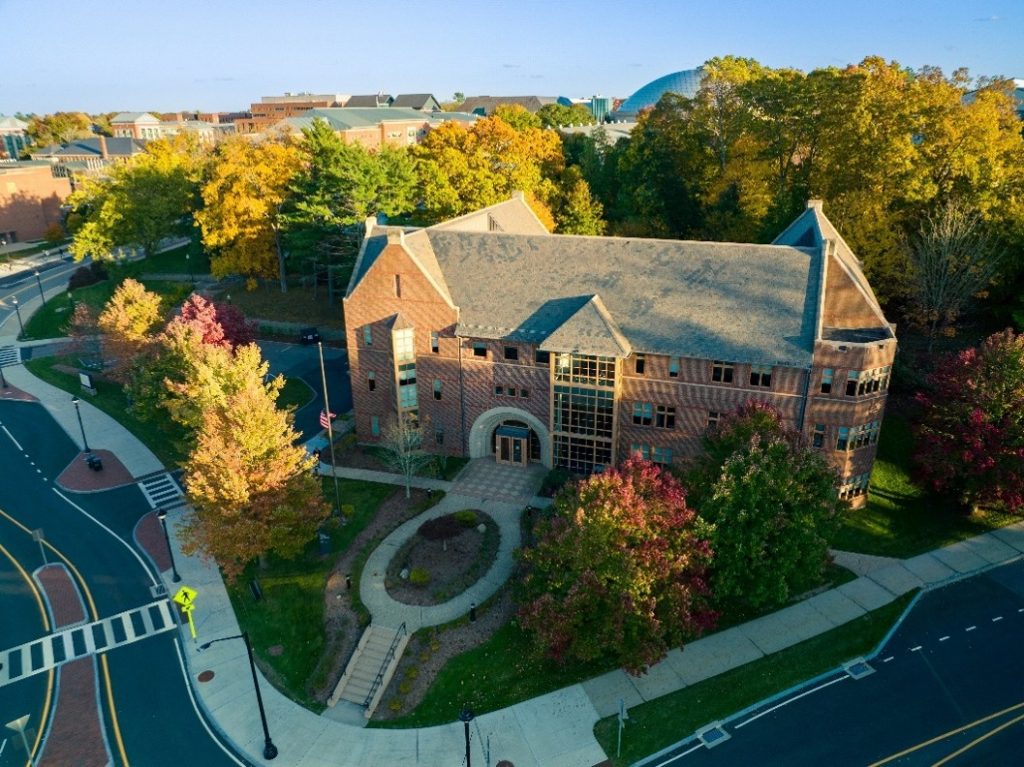 An aerial shot of the UConn Foundation building with fall foliage surrounding